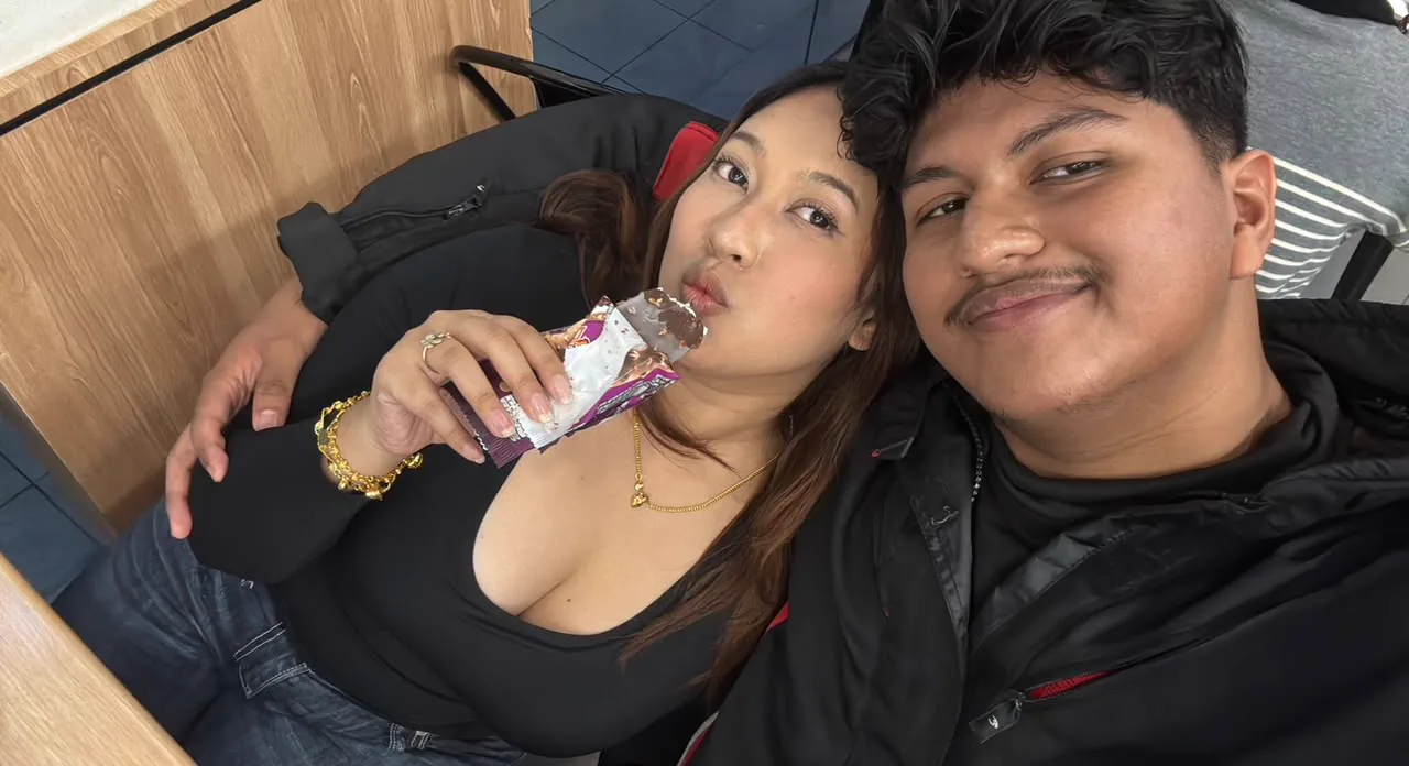 The two of you smiling together while sharing a snack break