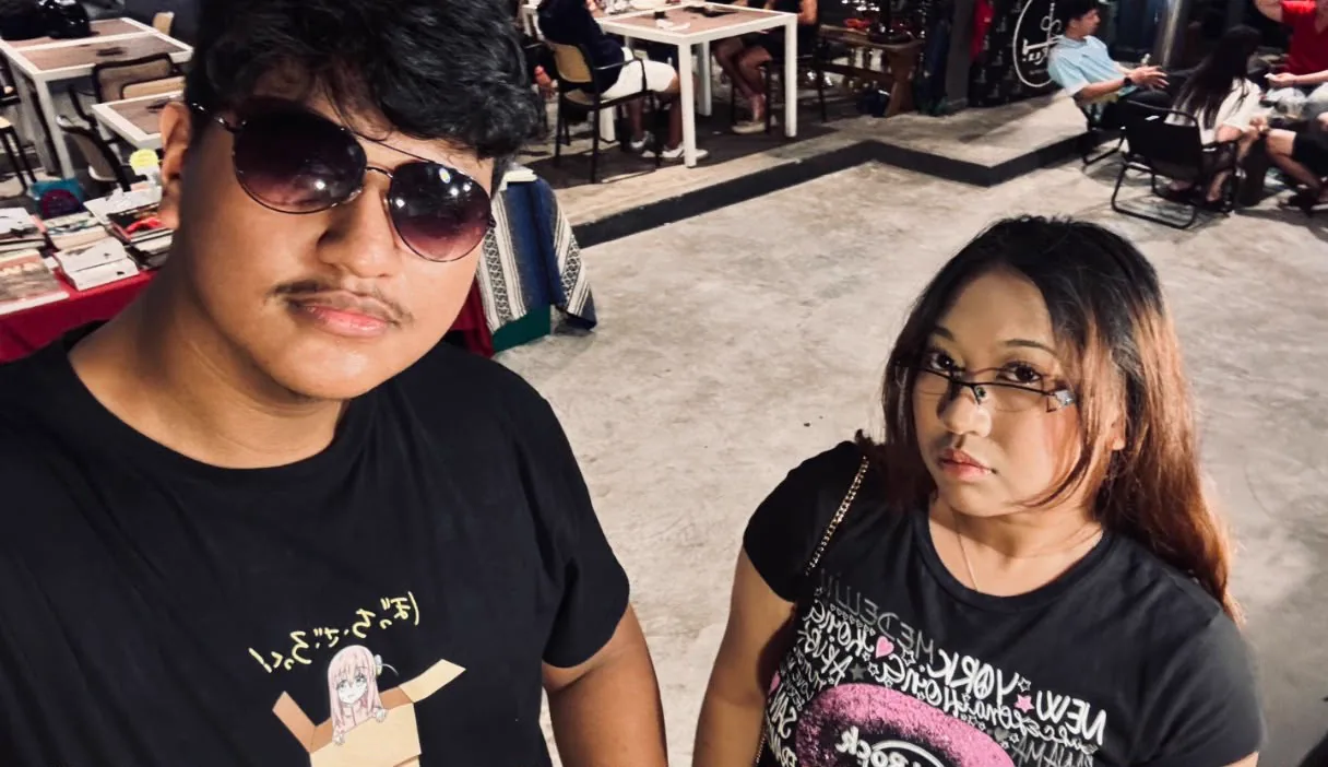 The two of you in matching black outfits at a market